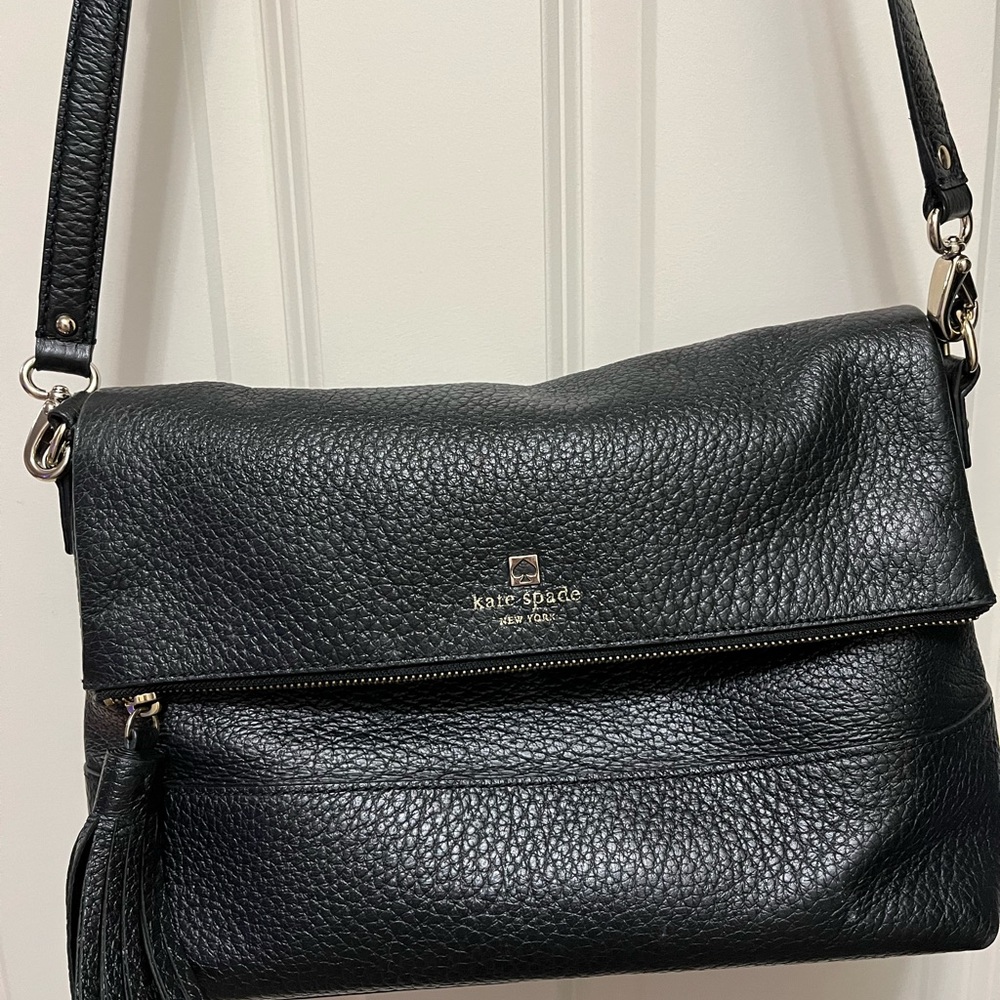 Kate Spade adjustable, and removable cross body strap.